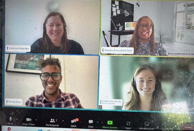 Photo of a laptop screen featuring a Zoom webinar. On screen you can see four cameras featuring the host and three panellists of this webinar.